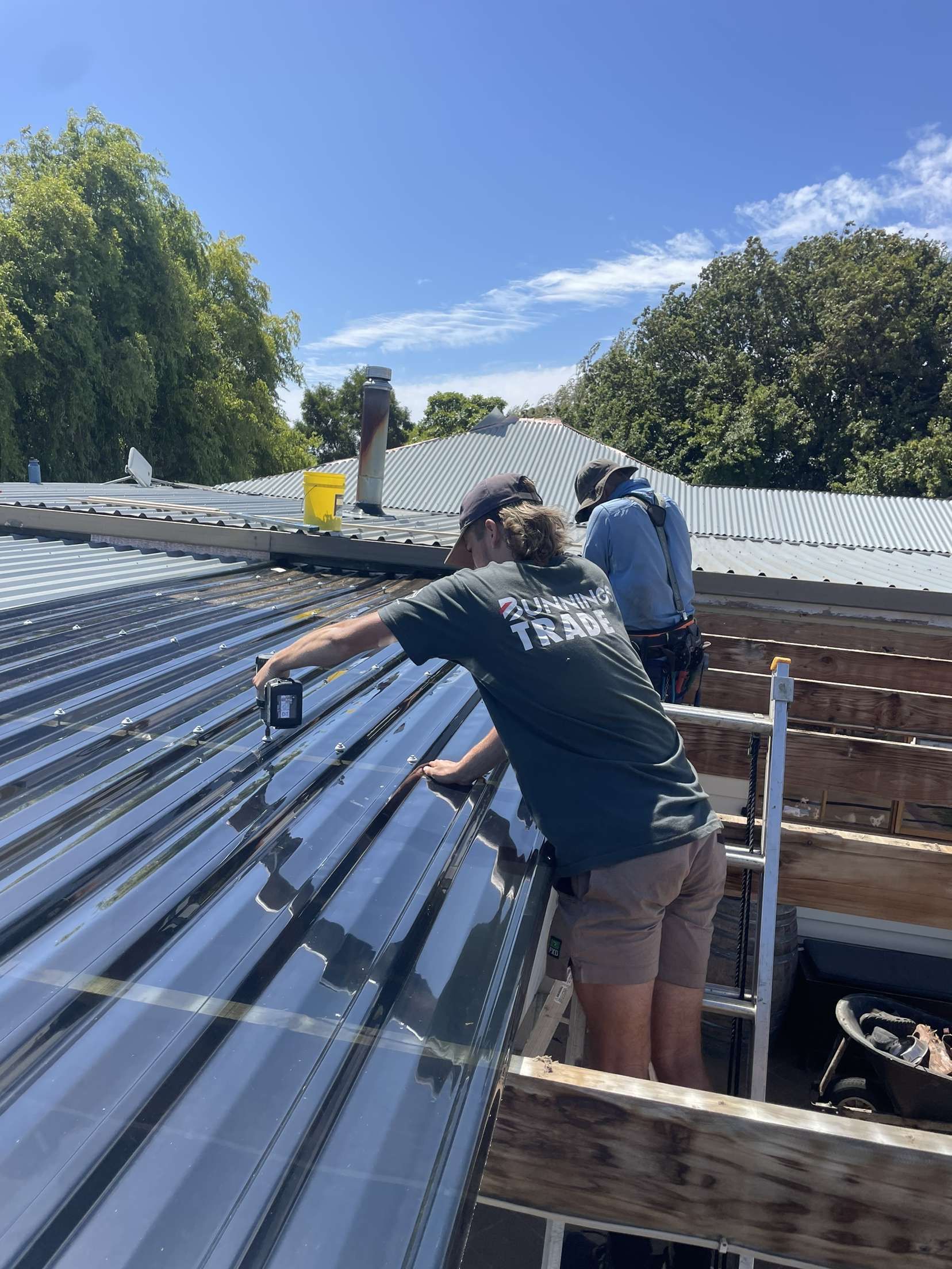 M.C Roofing team installing metal roofing