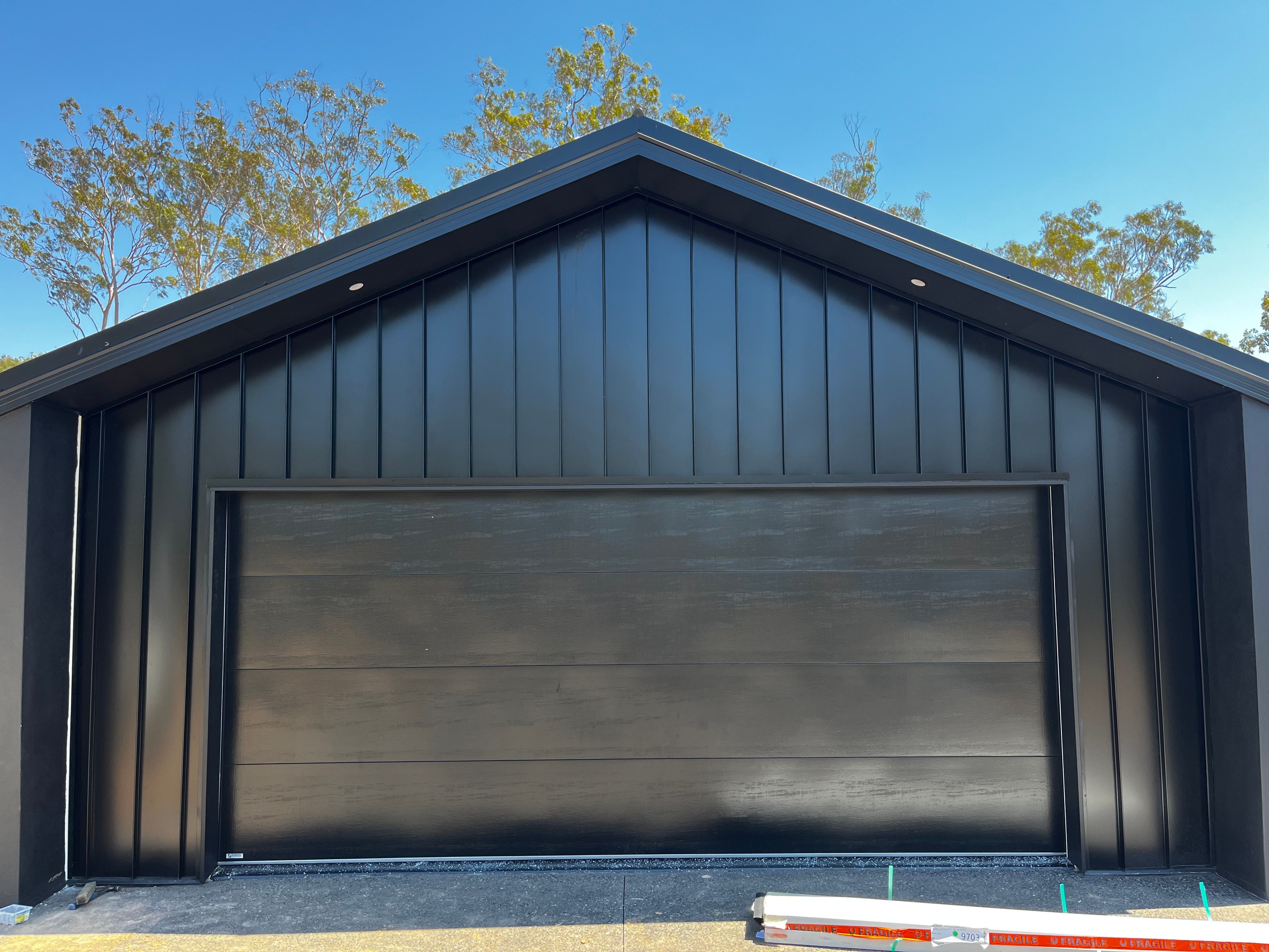 Black metal cladding building — new build