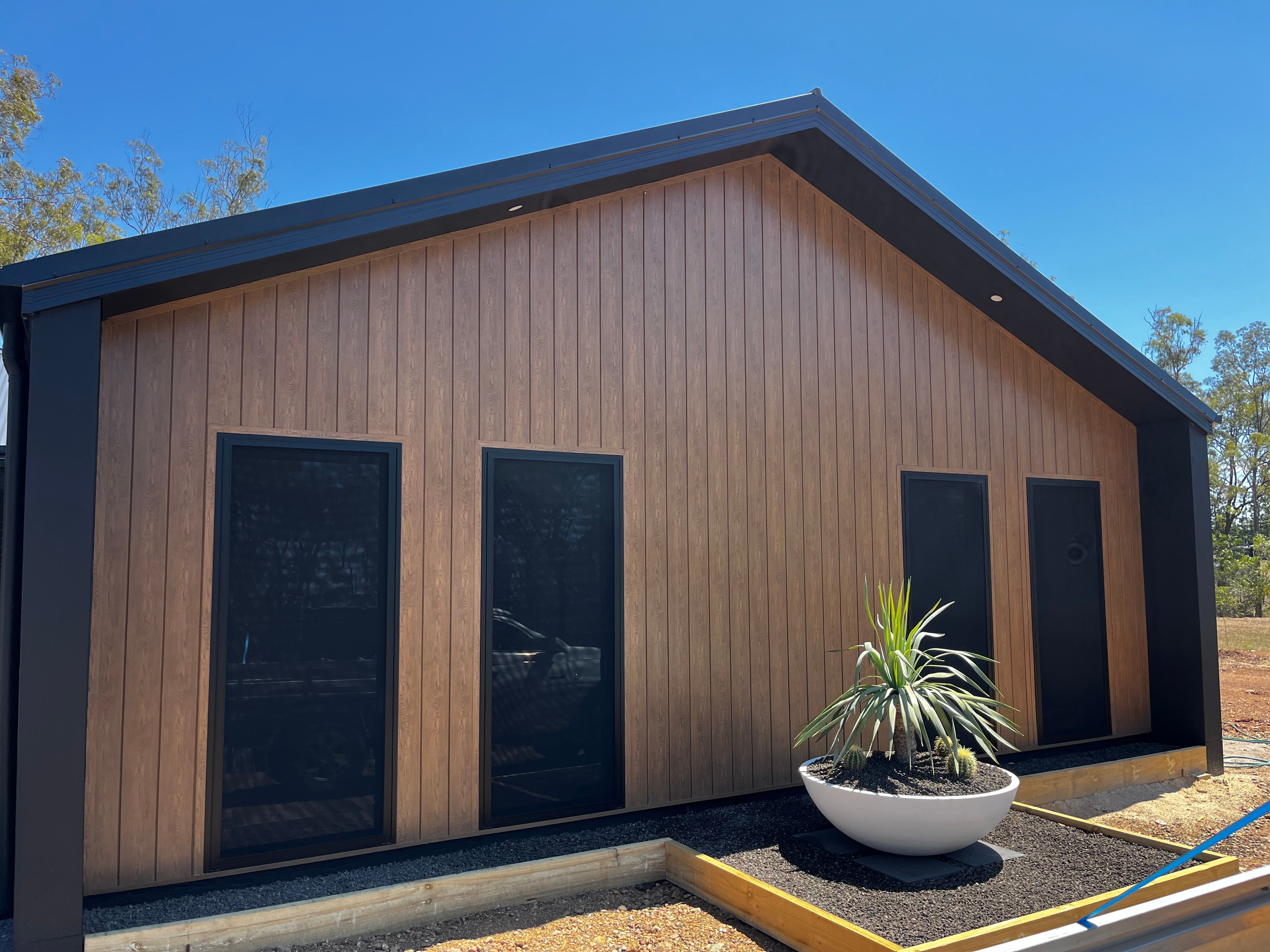 Timber-look cladding new build — front facade