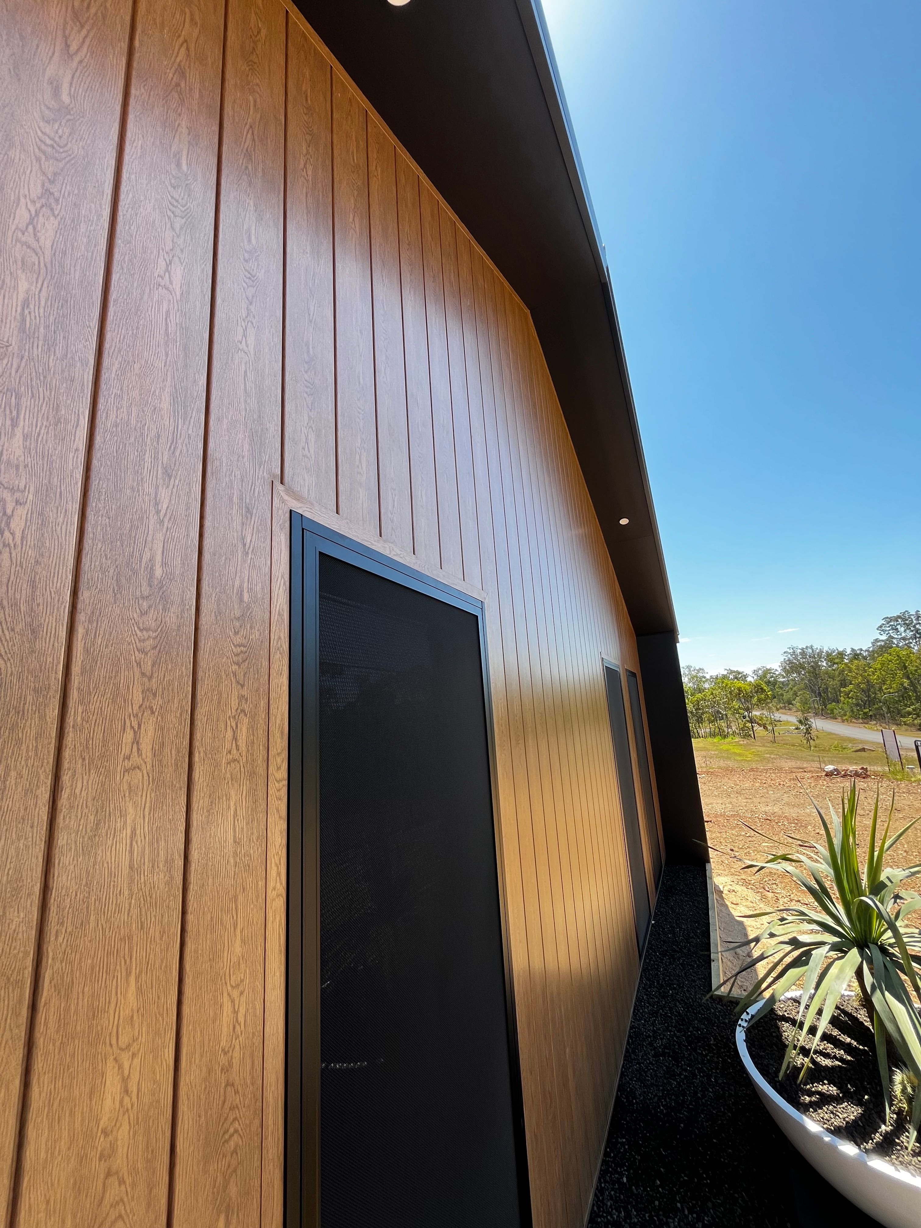 Timber-look cladding with black trim detail
